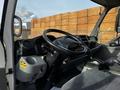 Interior view of a 2015 Hino 195 showing the dashboard and steering wheel with controls and gauges visible