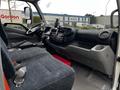 Interior of a 2018 Hino 195 featuring a driver’s seat, dashboard with controls, steering wheel, and center console with storage compartments