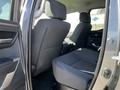 Interior view of the rear seats in a 2023 Toyota Tundra featuring black fabric upholstery and a spacious cabin design
