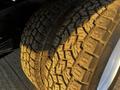 Close-up of a large, rugged tire with deep treads designed for traction on a 2017 Ford Econoline vehicle