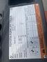 A close-up view of a Toyota forklift truck specification plate displaying model details serial number capacity information and safety warnings