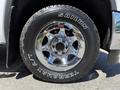 Close-up of a chrome wheel on a 2016 GMC Sierra 1500 with the tire brand Sailun and model Terramax A/T visible on the sidewall
