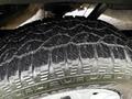 Close-up of a worn tire on a 2018 Ford Transit showcasing the tread pattern and wear on the rubber surface