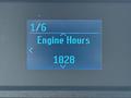 Display screen showing engine hours on a 2023 Ford E-450 with a reading of 1828 hours