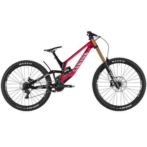 2025 Canyon Sender CFR Mullet Mountain Bike featuring a striking pink frame large tires and a dual suspension system designed for advanced mountain biking performance