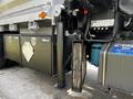 2017 International WorkStar 7600 with a dump body featuring hydraulic components and storage compartments on the side