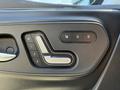 Close-up of the driver's side door control panel in a 2023 Mercedes-Benz Sprinter featuring seat adjustment buttons and lock controls