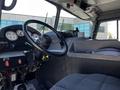 Interior view of a 2006 Emergency One Fire Truck featuring a steering wheel dashboard with gauges and controls