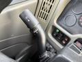 Close-up of a 2013 International Durastar 4300 control stalk featuring wiper settings and various buttons for vehicle functions