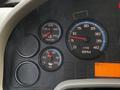 Dashboard of a 2013 International Durastar 4300 showing gauges for water temperature oil pressure and RPM
