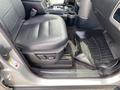 Interior view of a 2006 Land Rover LR3 showing the driver's seat gear shifter and floor mat
