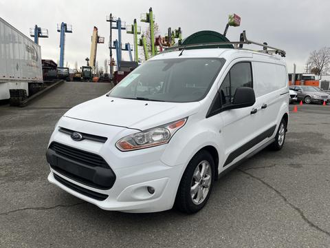 A white 2017 Ford Transit Connect van with a black grille and a ladder rack on the roof is parked in a lot