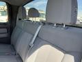 A 2014 Ford F-150 with gray fabric seats featuring adjustable headrests and seatbelts in the back row