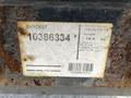 A label on a metal bracket displaying production date weight and model number for a 2011 Kubota M8540D