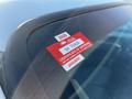 A red and white approval sticker on the windshield of a 2008 Ford F-450 SD indicating a certificate of approval for January 2026