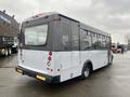 A 2017 Chevrolet Express bus with a sleek design featuring large windows and a two-tone color scheme of gray and white