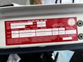A 2006 Hino 268 vehicle information sticker detailing specifications such as weight capacity and tire size