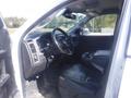 Interior view of a 2019 RAM 1500 Classic Eco Diesel featuring a black leather driver's seat steering wheel dashboard and center console