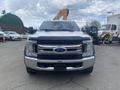 A 2017 Ford F-550 truck facing forward with a gray front grill and black bumper