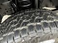 Close-up of a rugged tire tread on a 2020 Ford F-350 SD showing deep grooves and thick rubber designed for off-road traction