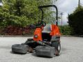 A 2015 Jacobsen Eclipse golf course mower with a red chassis and four rotatable cutting decks in front