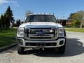 A 2016 Ford F-550 truck viewed from the front with a chrome grille and six roof lights