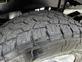 Close-up of a rugged tire tread from a 2020 Ford F-350 Super Duty showcasing deep grooves and textured surface for enhanced traction
