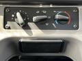 Dashboard controls of a 2012 Freightliner M2 106 featuring dials for fan speed and temperature adjustment