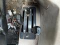 Control levers on the operator panel of a 2011 Kubota M8540D tractor with markings for speed and direction settings