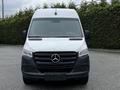 A 2019 Mercedes-Benz Sprinter van facing forward with a silver body and black grille featuring the Mercedes-Benz logo