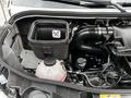 Close-up view of the engine compartment of a 2020 Mercedes-Benz Sprinter showing an air filter housing and various engine components