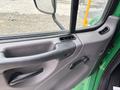 The interior door panel of a 2015 Freightliner M2 106 featuring a handle air vent and controls for window adjustment and door locking