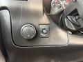 Interior dashboard controls of a 2019 Chevrolet Express featuring light adjustment and dome light switch