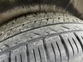 Close-up of a worn tire tread from a 2018 Mercedes-Benz Metris showing visible grooves and dirt accumulation