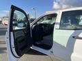 2018 GMC Sierra 1500 with an open driver's side door showing the interior including the steering wheel and dashboard