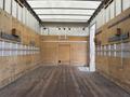 2008 Chevrolet Express cargo van with a wooden interior equipped with hooks and a flat wooden floor