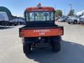 A 2018 Kubota ATV with an orange maintenance lube sign on the back and four wheel drive markings