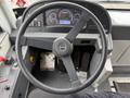 Steering wheel and dashboard of a 2018 Grande West Vicinity bus with controls and displays visible