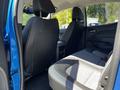 Interior view of the back seats of a 2021 Chevrolet Colorado with black leather upholstery and a spacious layout