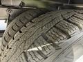 Close-up of two worn tires from a 2016 Ford Transit showing tread pattern and condition