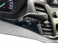 Control stalk for windshield wipers and turn signals in a 2019 Ford Transit Connect featuring icons for off mist and intermittent settings