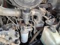 Close-up of the engine components of a 2014 Toro Groundmaster 5910 including fuel lines and filters with various metal and plastic parts