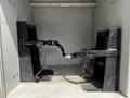 Interior mounts for a 2009 Ford F-550 featuring two black metal brackets with securing mechanisms positioned inside a compartment