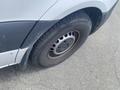 A close-up of a tire on a 2022 Mercedes-Benz Sprinter showing the wheel and tire design