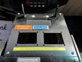Control panel with labels for ground sweeps and volume pumping in a 2009 Ford F-550 truck