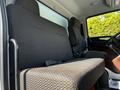 Interior of a 2021 Hino 338 showing the driver's seat and passenger seat with patterned upholstery and seatbelts