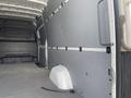 The interior of a 2025 Mercedes-Benz Sprinter van featuring a plain wall with a smooth surface and no visible cargo or fixtures