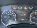 Dashboard of a 2012 Ford F-150 showing speedometer fuel gauge and odometer with a trip distance of 572 miles and total mileage of 153841 miles
