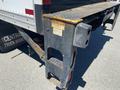 A 2015 Ford F-450 SD truck with a visible hitch and step area showing signs of wear and tear