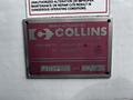Metal manufacturer’s plate attached to a vehicle displaying details such as the company name Collins the serial number and a date